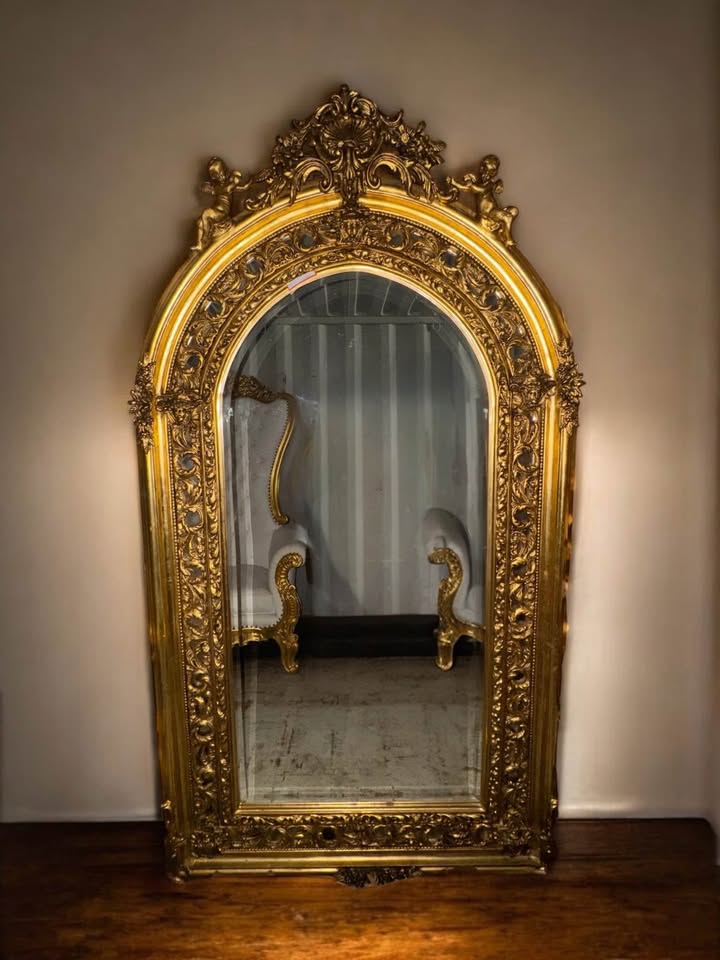 Palatial French Gilt Mirror with Cherubs & Rococo Flourish