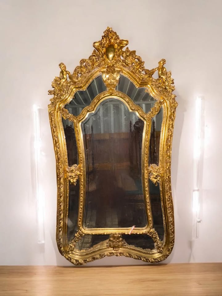 Baroque Gilt Mirror with Cherub Crest & Shaped Glass