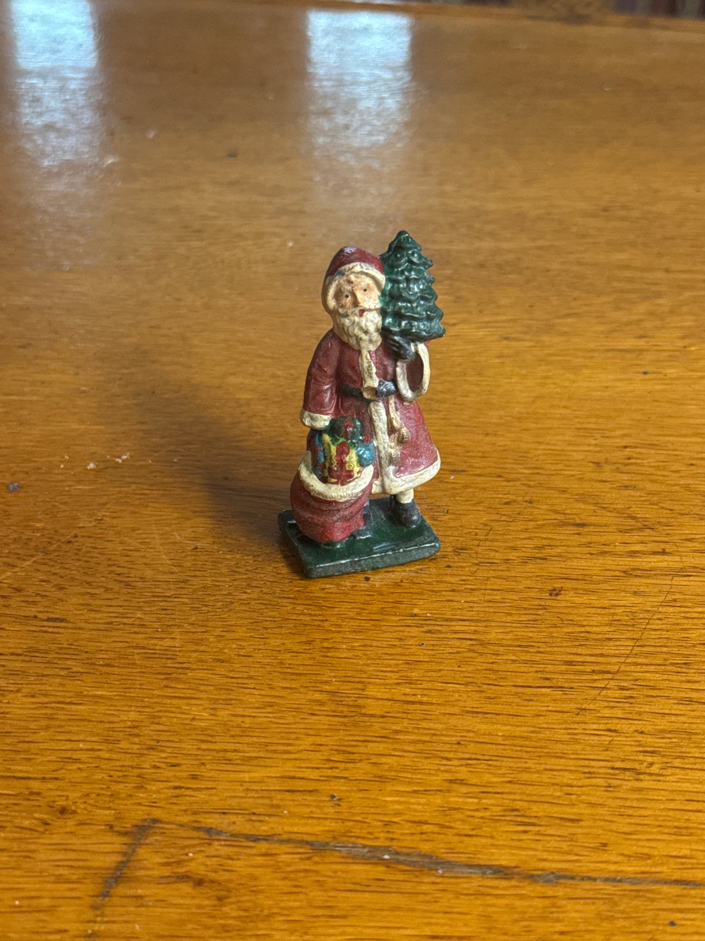 Solid Lead Santa Claus with Toys Statue