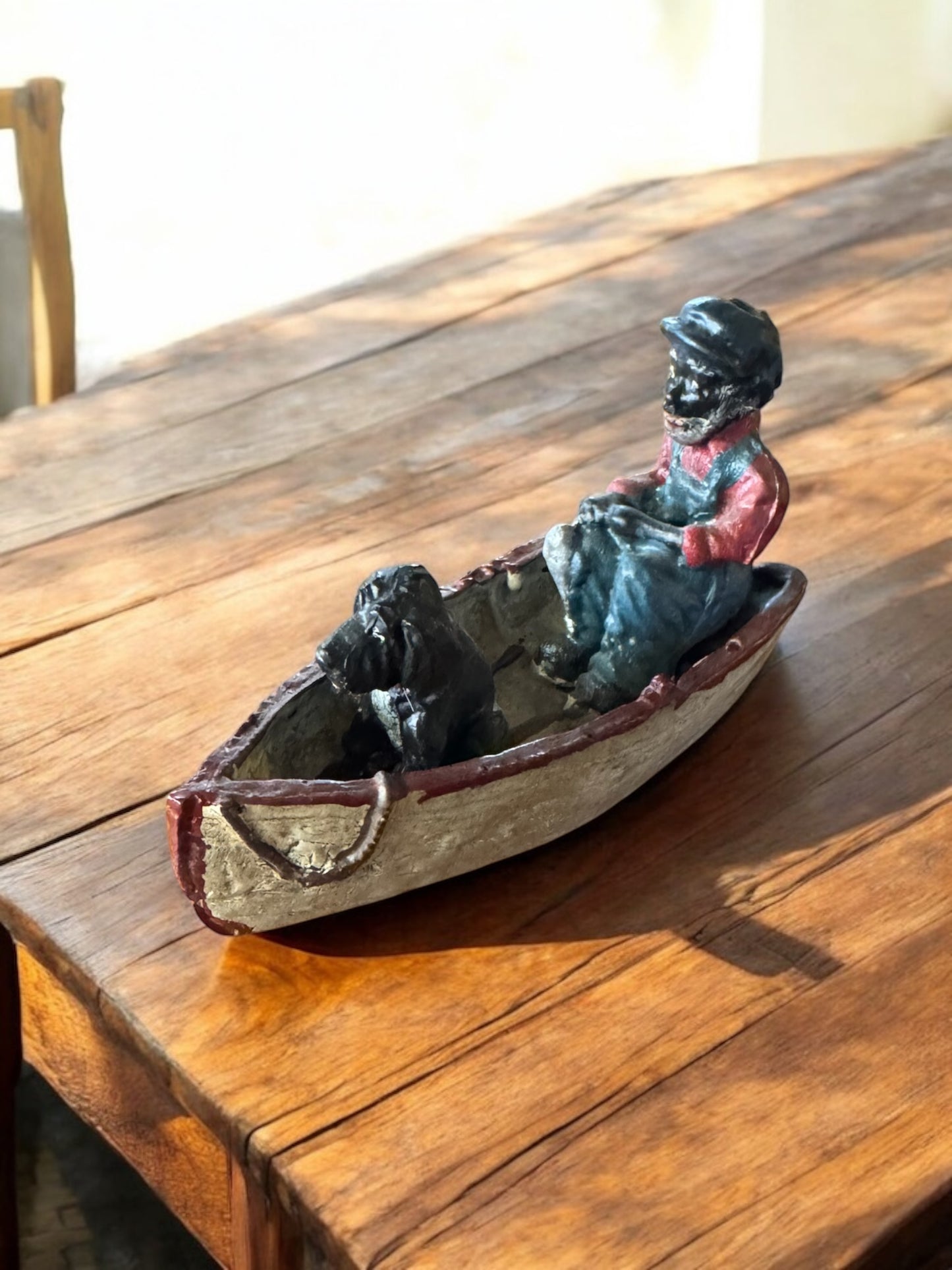 Lead Black Americana Man With Dog in boat