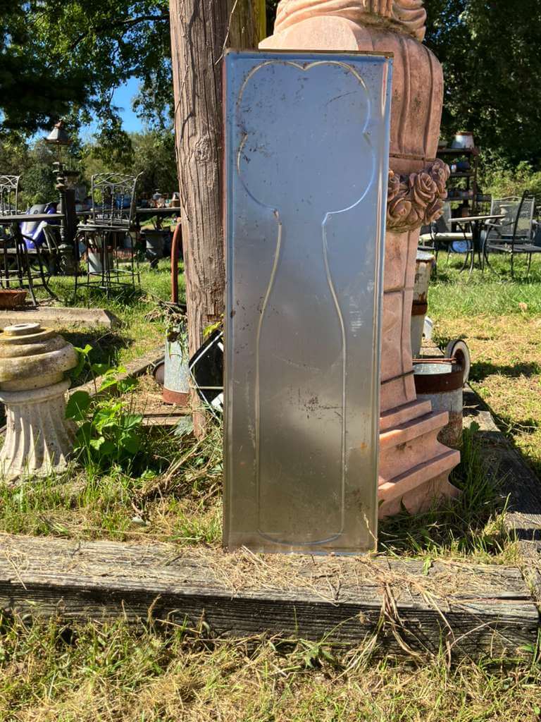 Vintage-Style "Drink O-So Grape Soda" Advertising Sign in a retro outdoor setting with decorative furnishings.