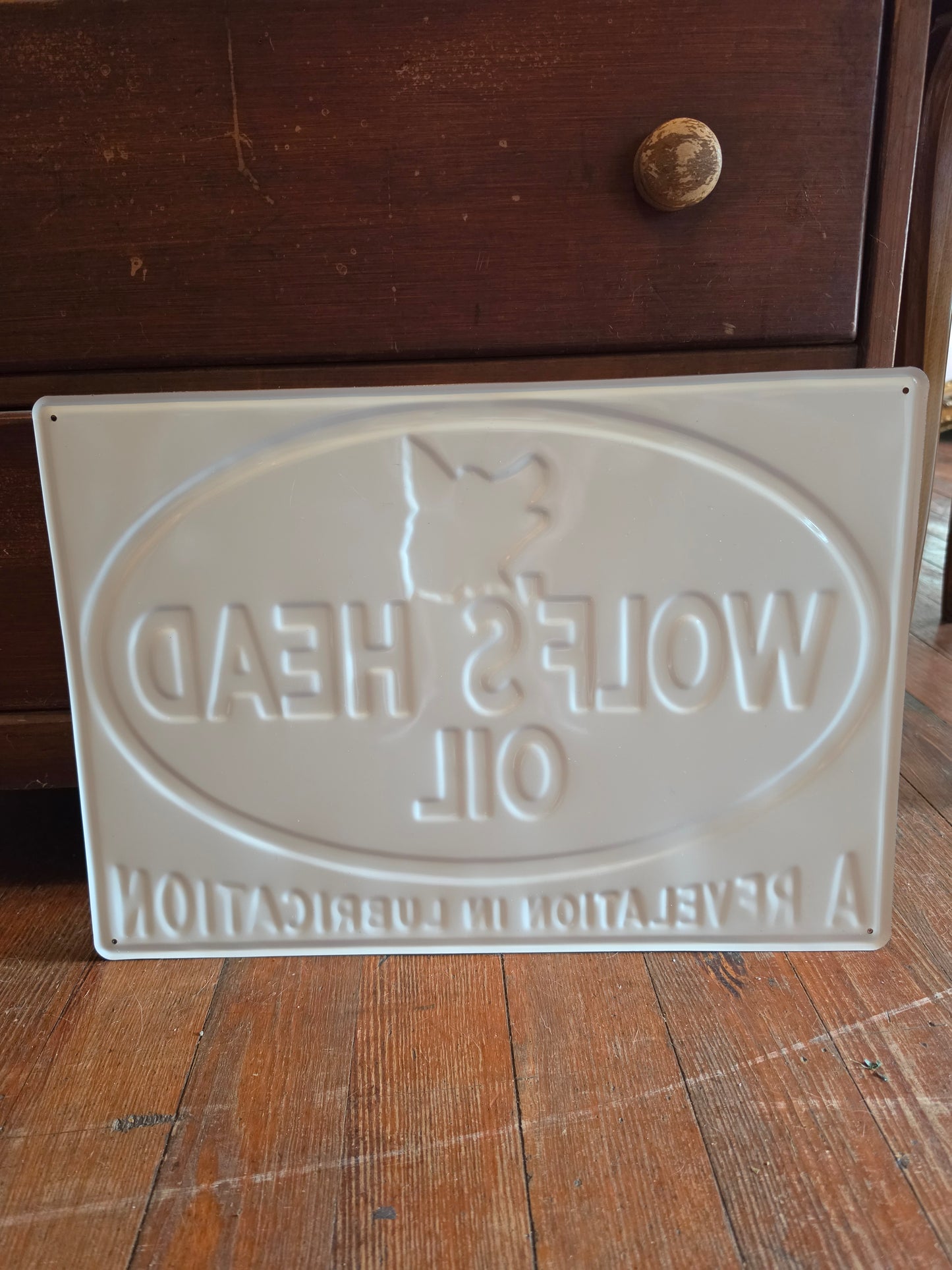 Wolf's Head Oil metal sign