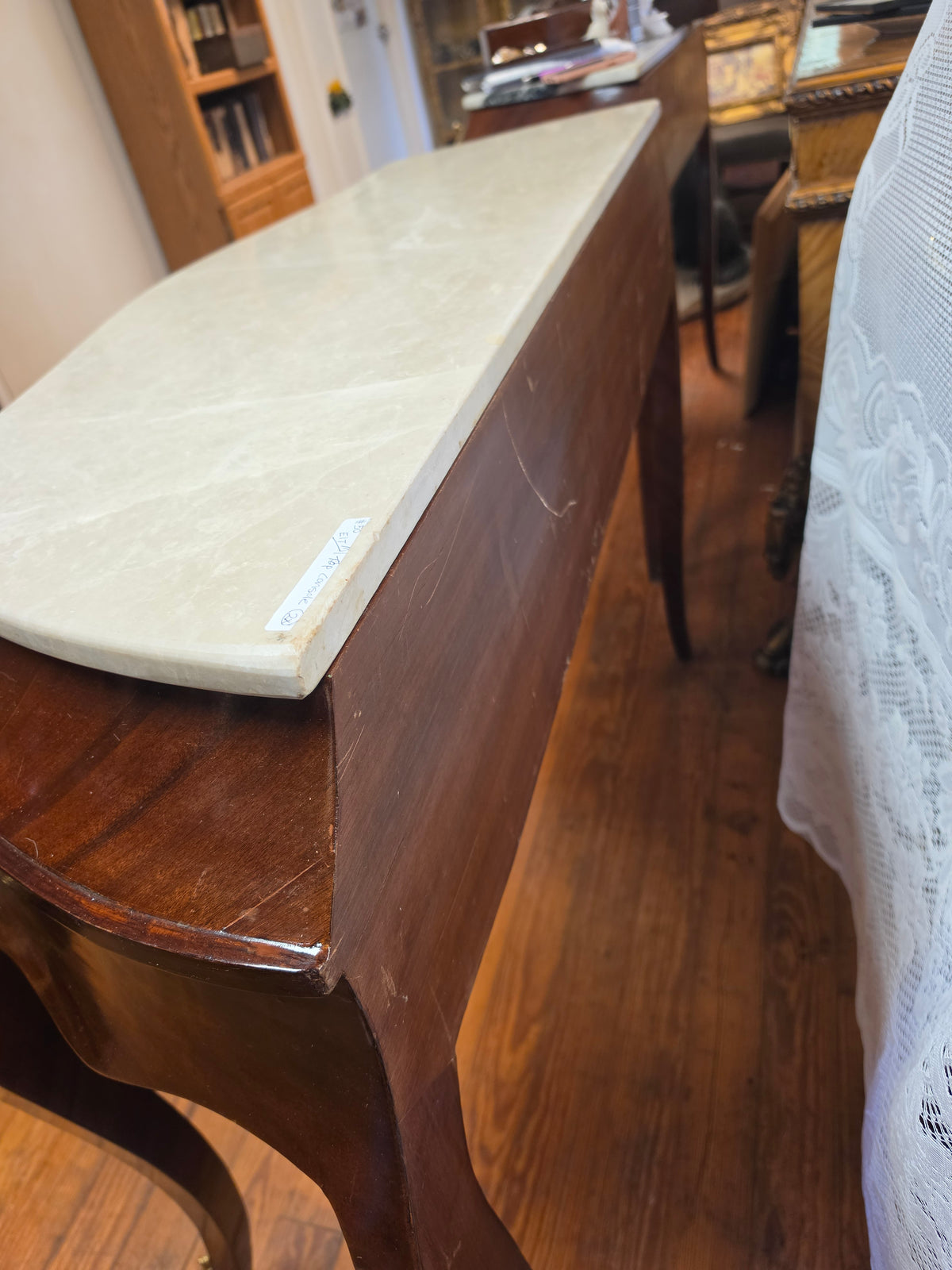 Console Table featuring a Shaped Cream Color Marble top