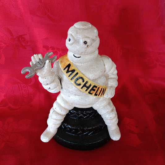 Michelin Figurine -Cast Iron Michelin Man Sitting on Tire Advertising Piece-Jantiques LLC.