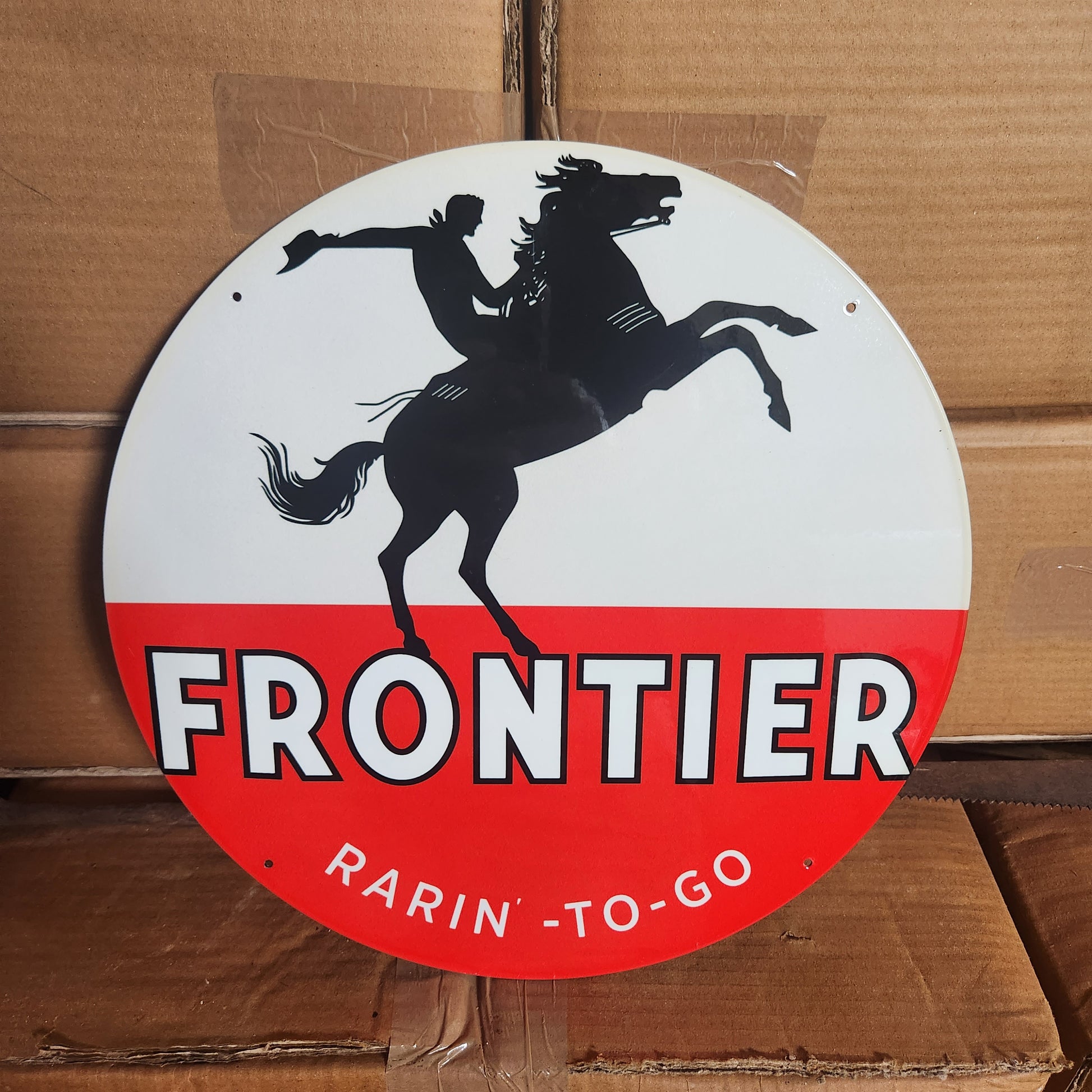 Frontier 12inch round sign.-Jantiques LLC.