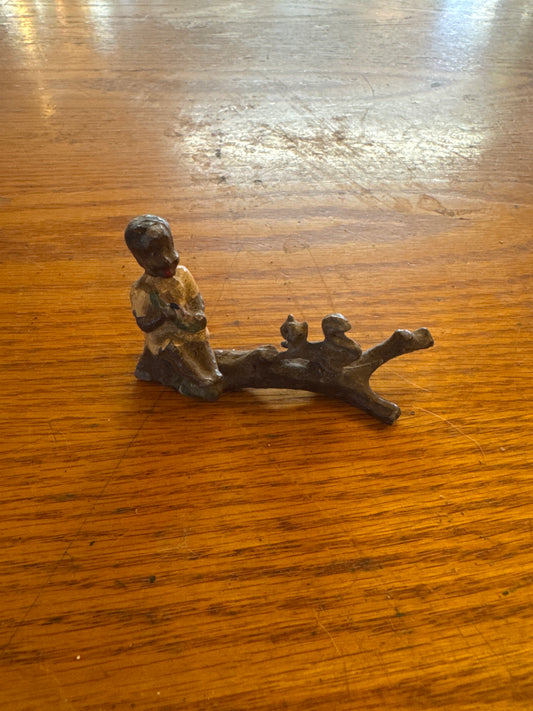 Lead Black Americana boy with squirrel