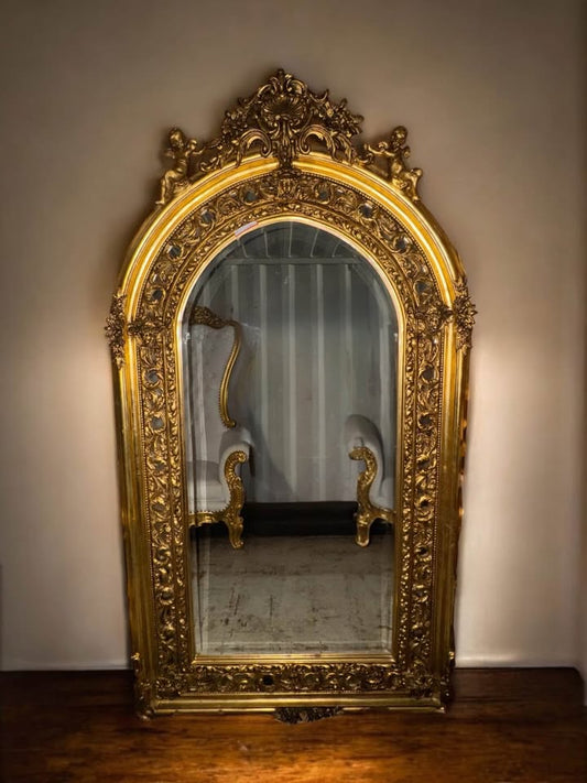 Palatial French Gilt Mirror with Cherubs & Rococo Flourish