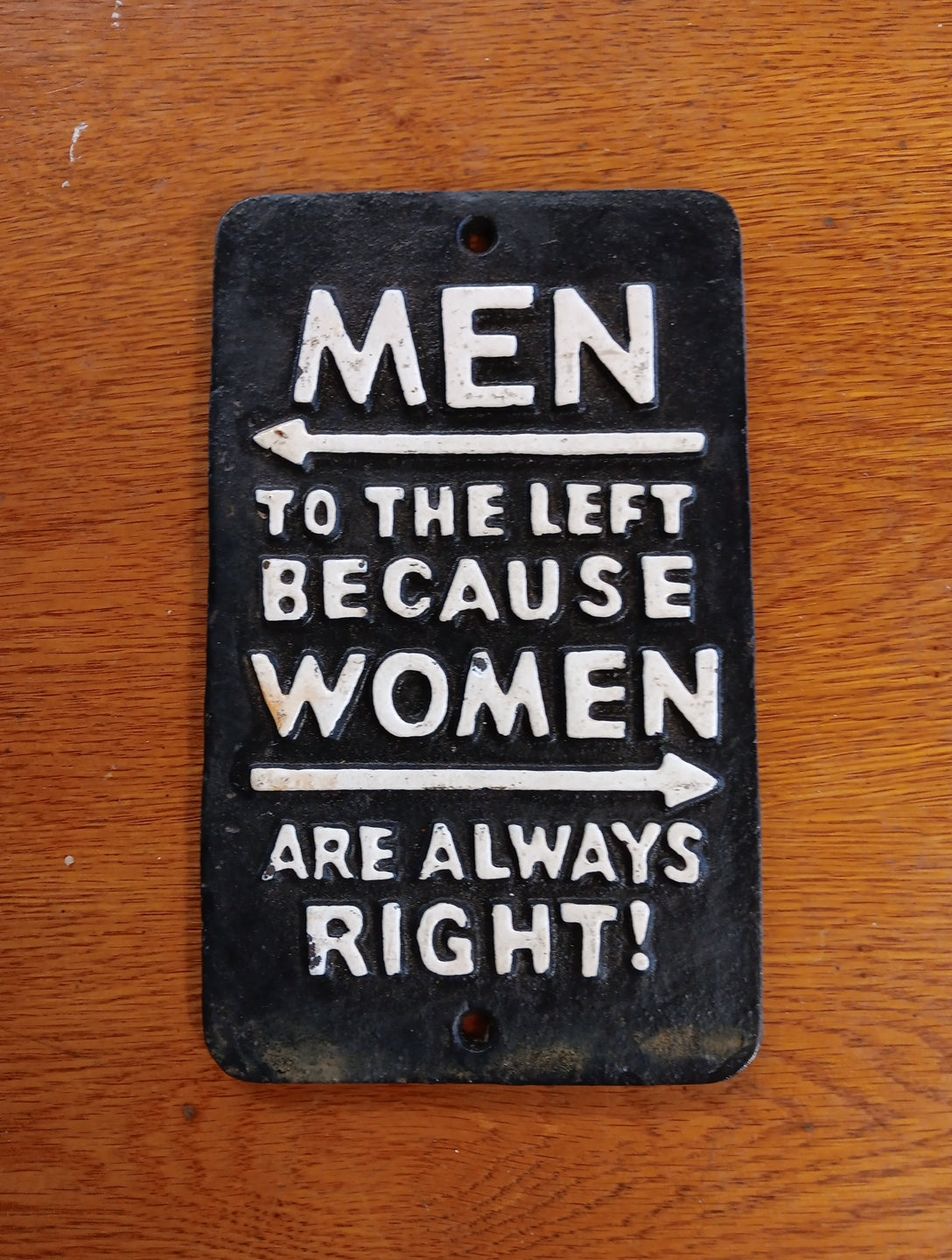 Men to the left because women are always right cast iron sign-Jantiques LLC.