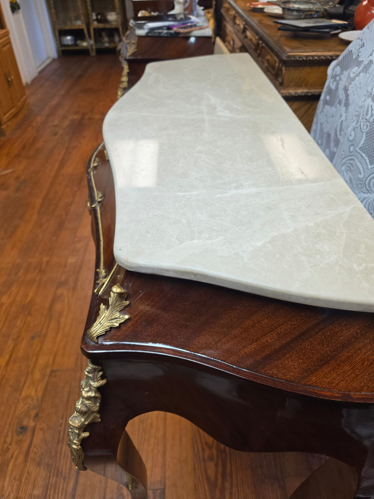 Console Table featuring a Shaped Cream Color Marble top