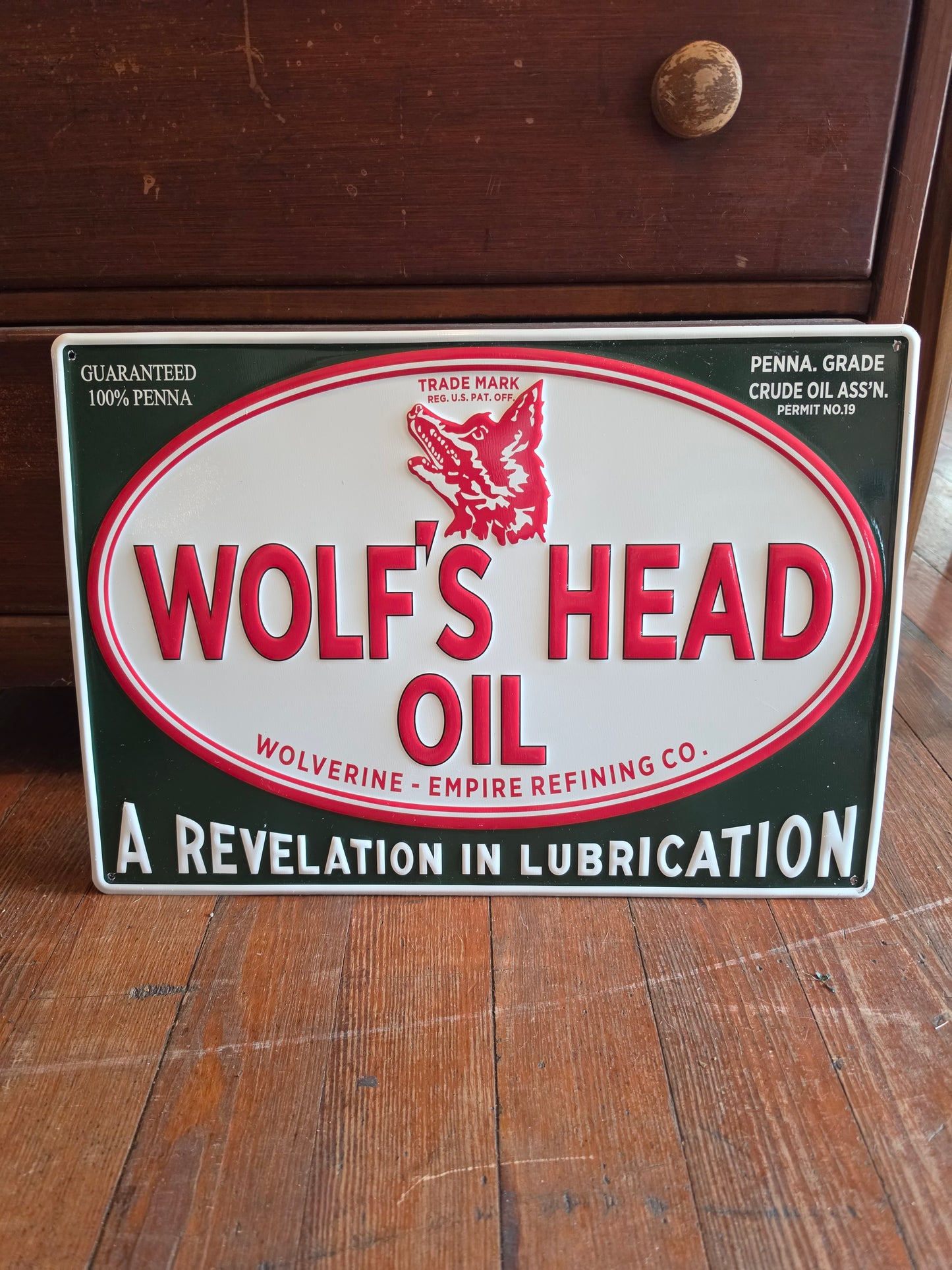 Wolf's Head Oil metal sign