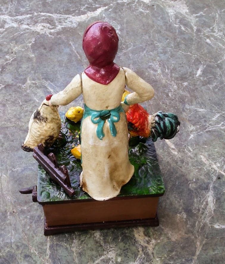 Cast Iron Mechanical Bank - Farm Woman Feeding Chickens Musical-Jantiques LLC.