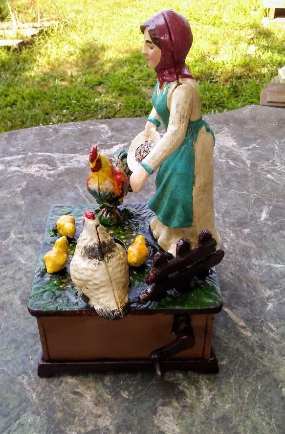 Cast Iron Mechanical Bank - Farm Woman Feeding Chickens Musical-Jantiques LLC.