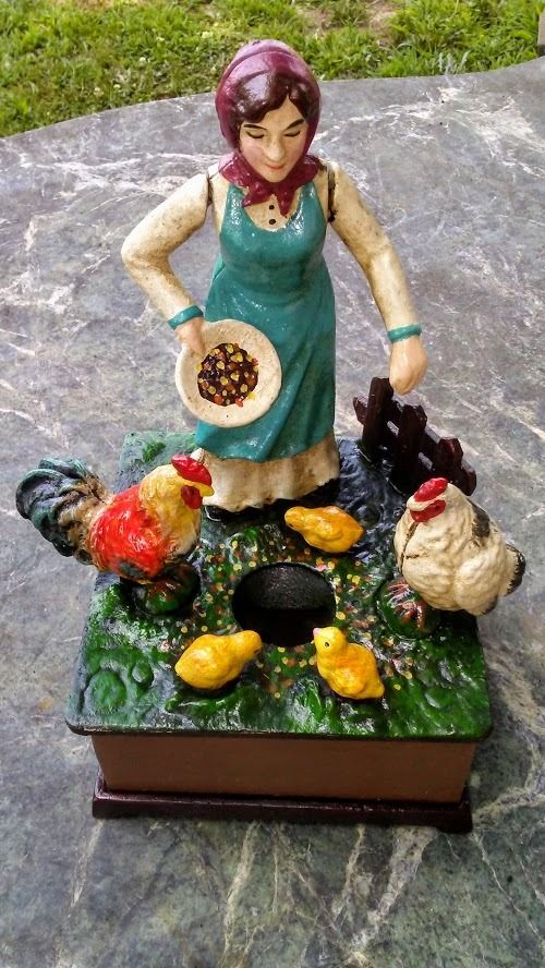 Cast Iron Mechanical Bank - Farm Woman Feeding Chickens Musical-Jantiques LLC.